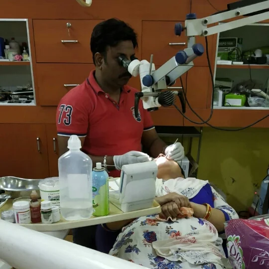 Dental surgeon performing treatment at MJ's Dental Clinic